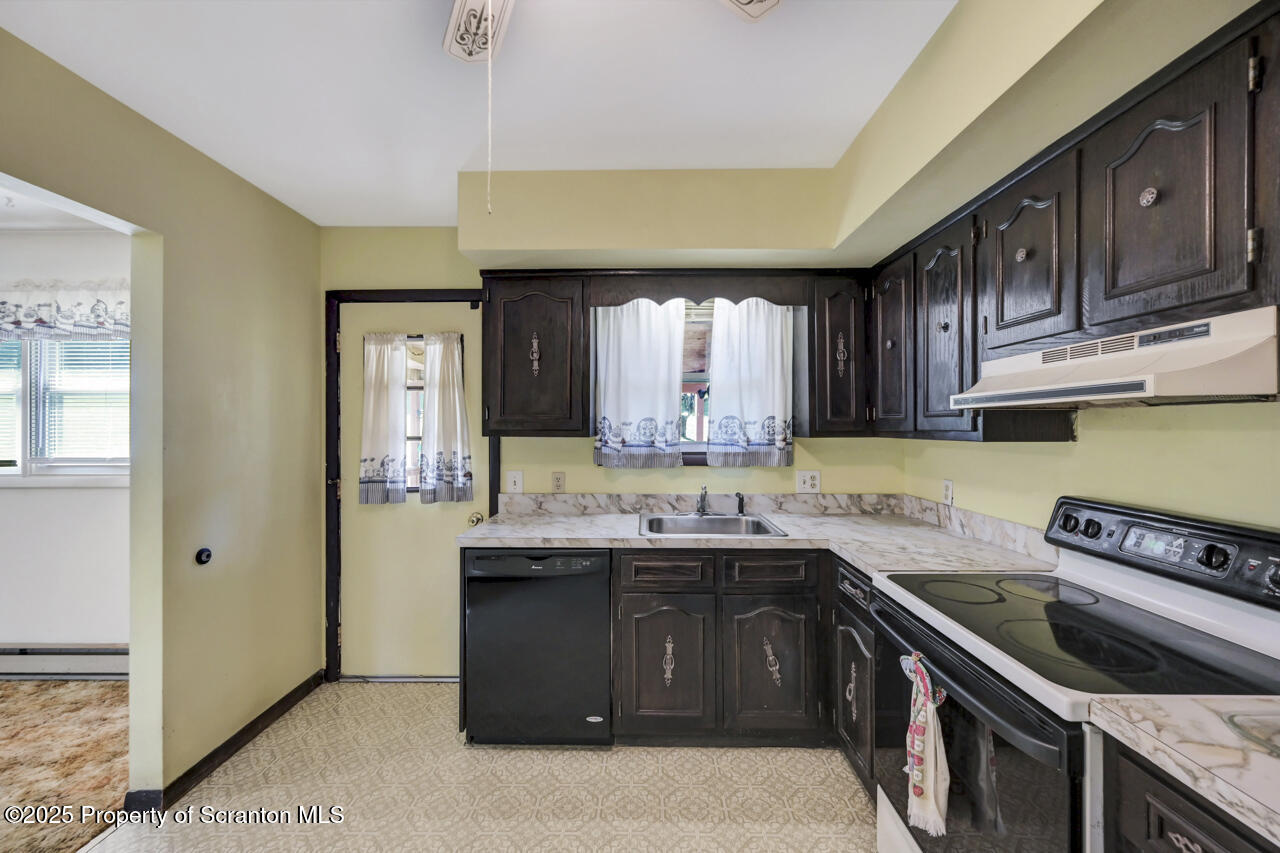 446 Maple Grove Road Moscow, PA 18444 - Photo 20 of 51 a kitchen with a sink and a stove