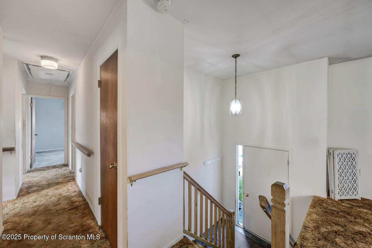 446 Maple Grove Road Moscow, PA 18444 - Photo 22 of 51 a view of a livingroom with wooden floor and stairs