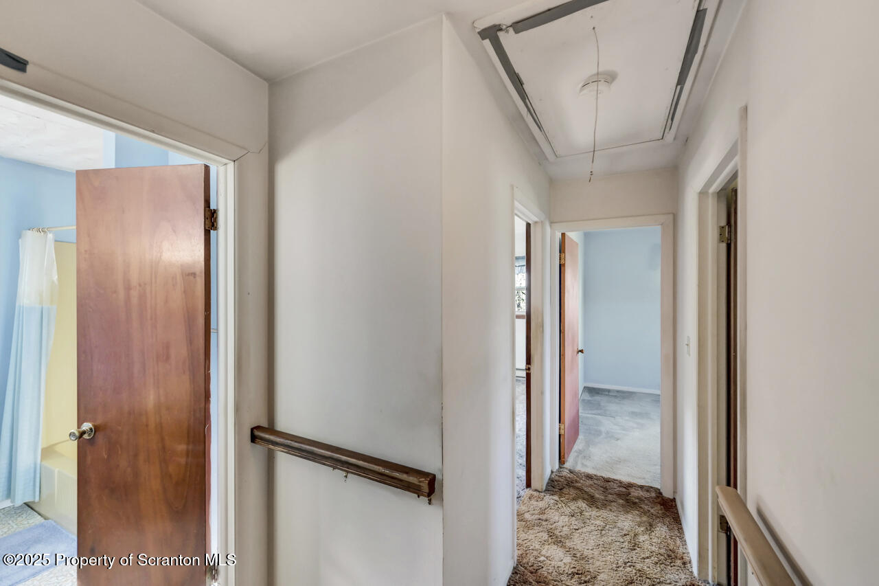 446 Maple Grove Road Moscow, PA 18444 - Photo 23 of 51 a view of a hallway with a glass door and furniture