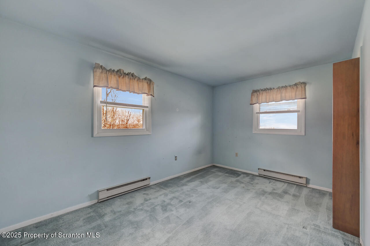 446 Maple Grove Road Moscow, PA 18444 - Photo 30 of 51 an empty room with windows