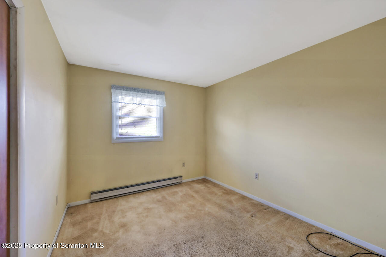 446 Maple Grove Road Moscow, PA 18444 - Photo 33 of 51 an empty room with windows