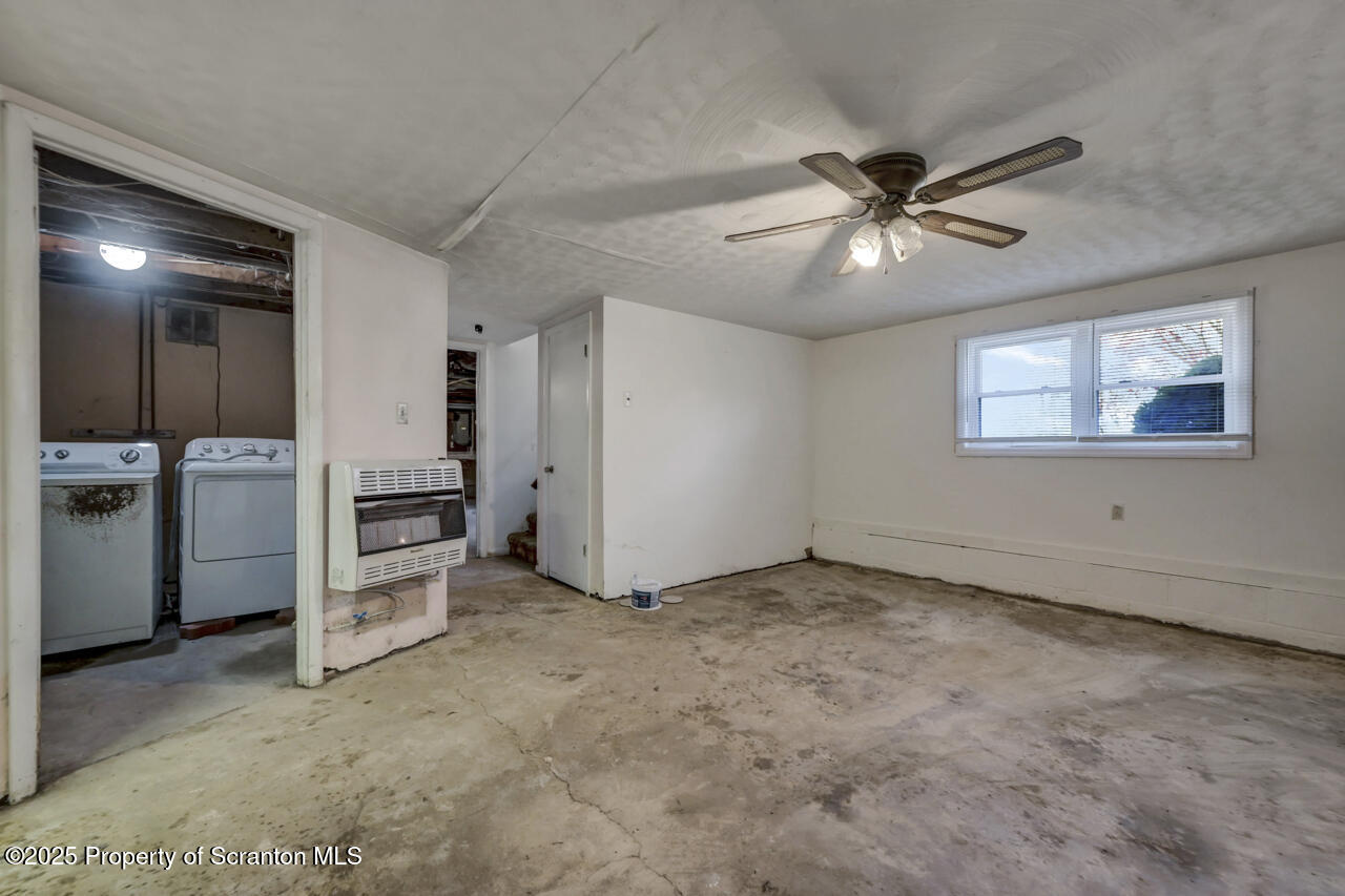 446 Maple Grove Road Moscow, PA 18444 - Photo 40 of 51 a view of a livingroom with an empty space and a kitchen