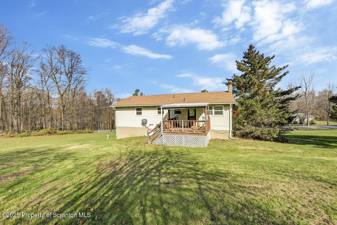 446 Maple Grove Road Moscow, PA 18444 - Photo 48 of 51 a view of a house with pool and a yard