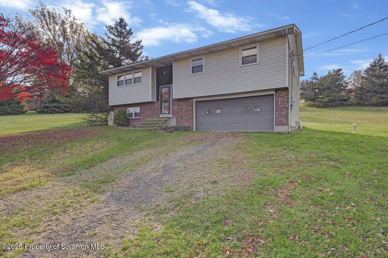 446 Maple Grove Road Moscow, PA 18444 - Photo 51 of 51 a view of a house with a yard