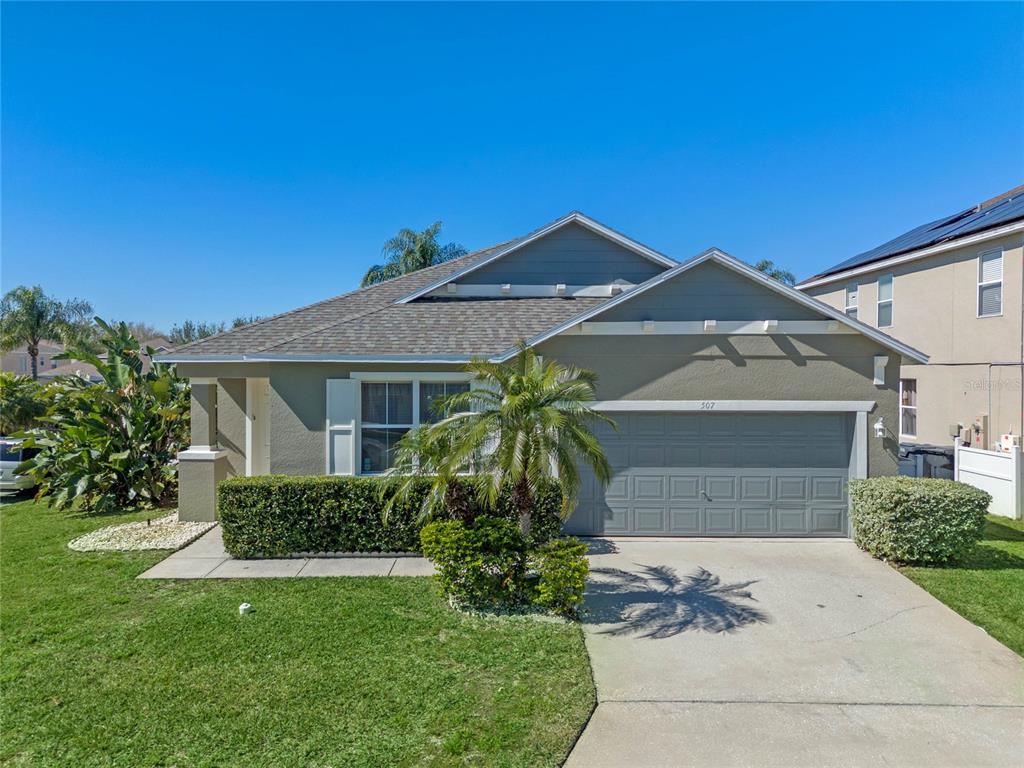 507 Kettering Road Davenport, FL 33897 - Photo 1 of 1 a front view of a house with a yard