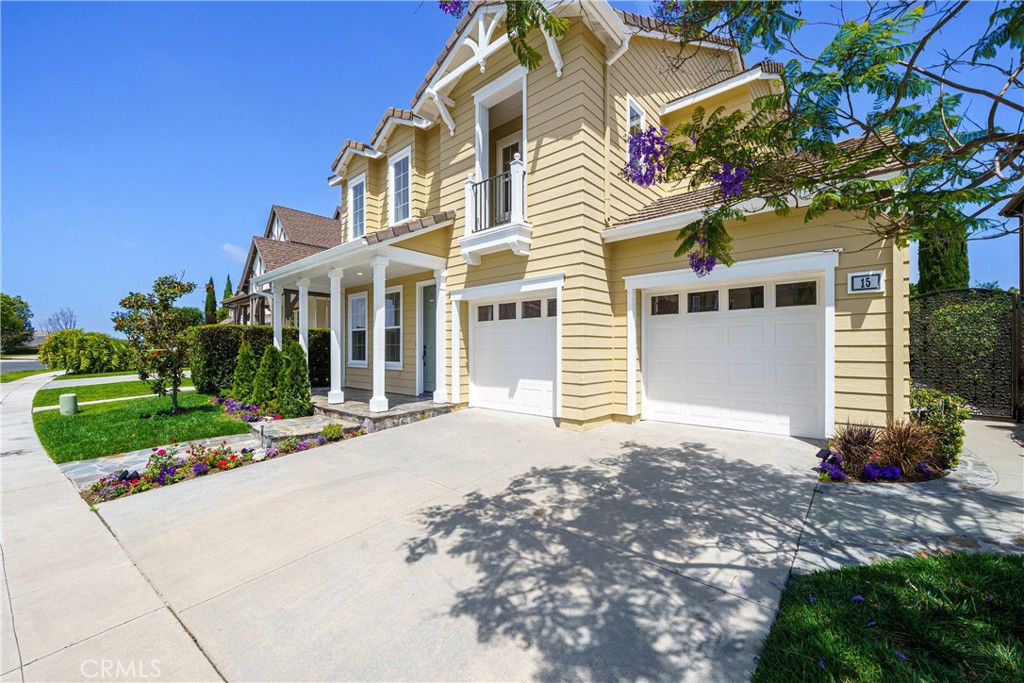15 Plum Street Ladera Ranch, CA 92694 - Photo 2 of 113 a view of a white house with a yard and plants