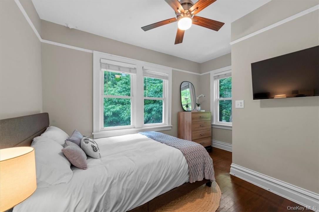 28 Inningwood Road Ossining, NY 10562 - Photo 23 of 37 Bedroom with dark hardwood / wood-style floors, multiple windows, and ceiling fan