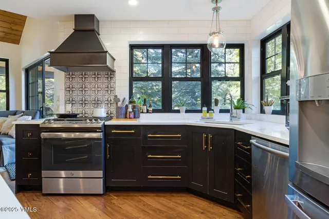 a kitchen with a sink and a stove