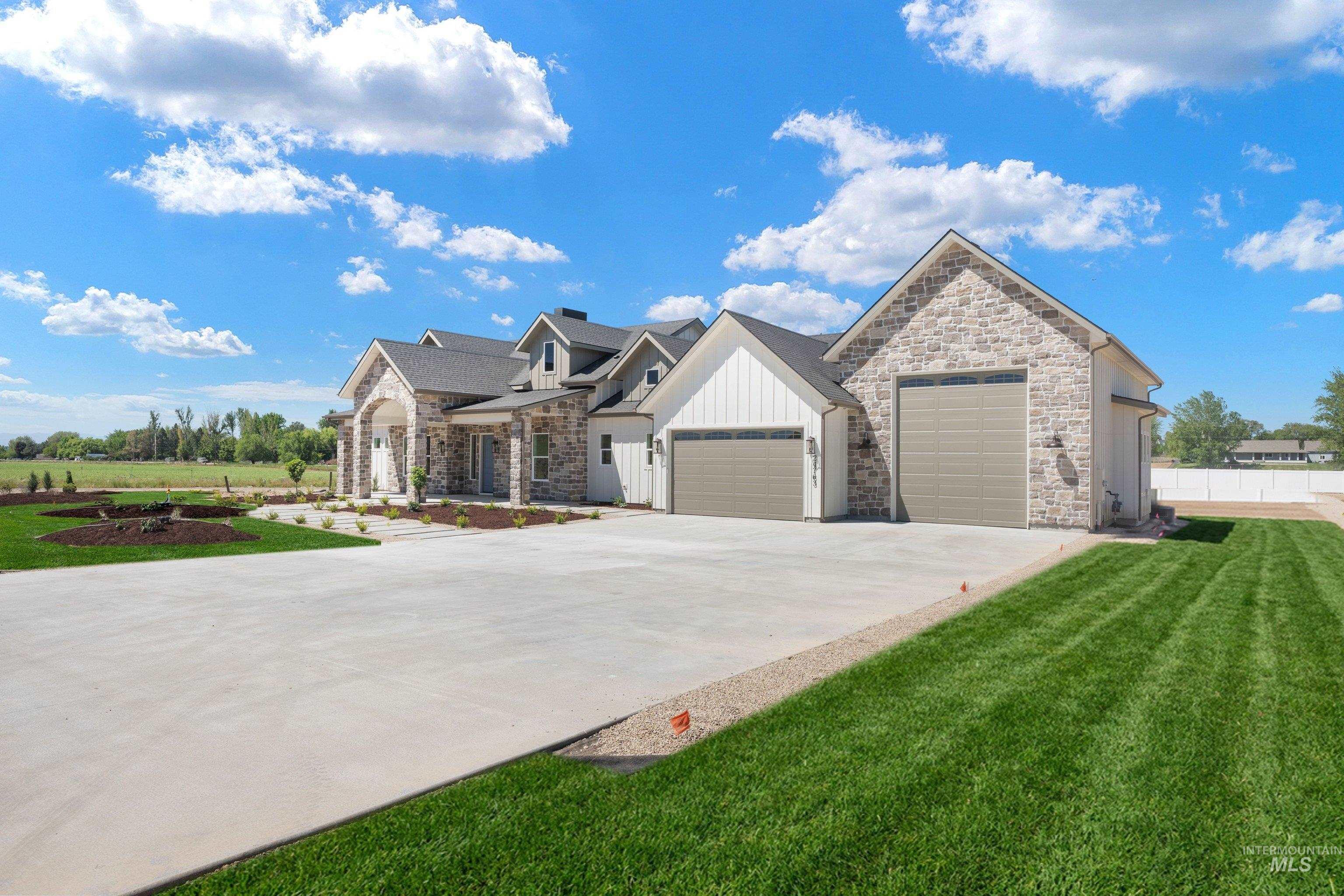 24763 Ardmore Court Caldwell, ID 83607 - Photo 40 of 50 Stone and siding exterior with a multi-gabled roofline
