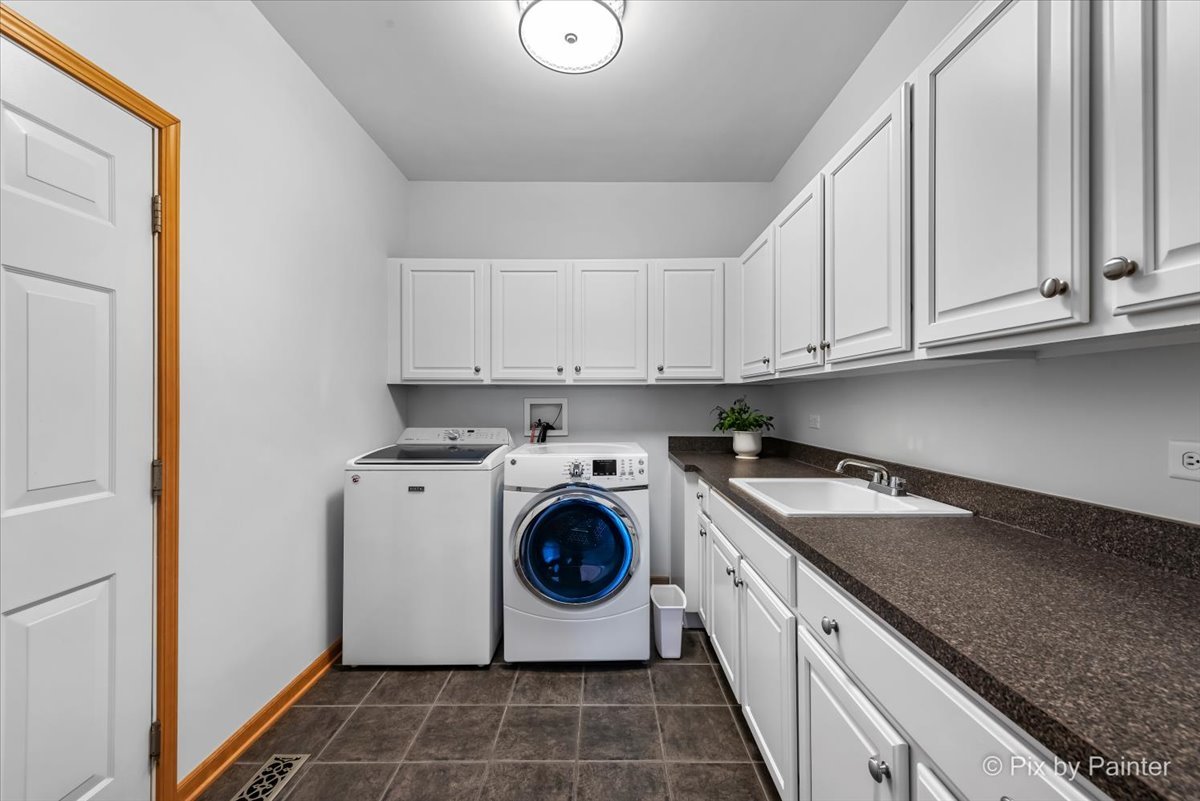 488 Newcastle Drive Cary, IL 60013 - Photo 17 of 33 a utility room with sink dryer and washer