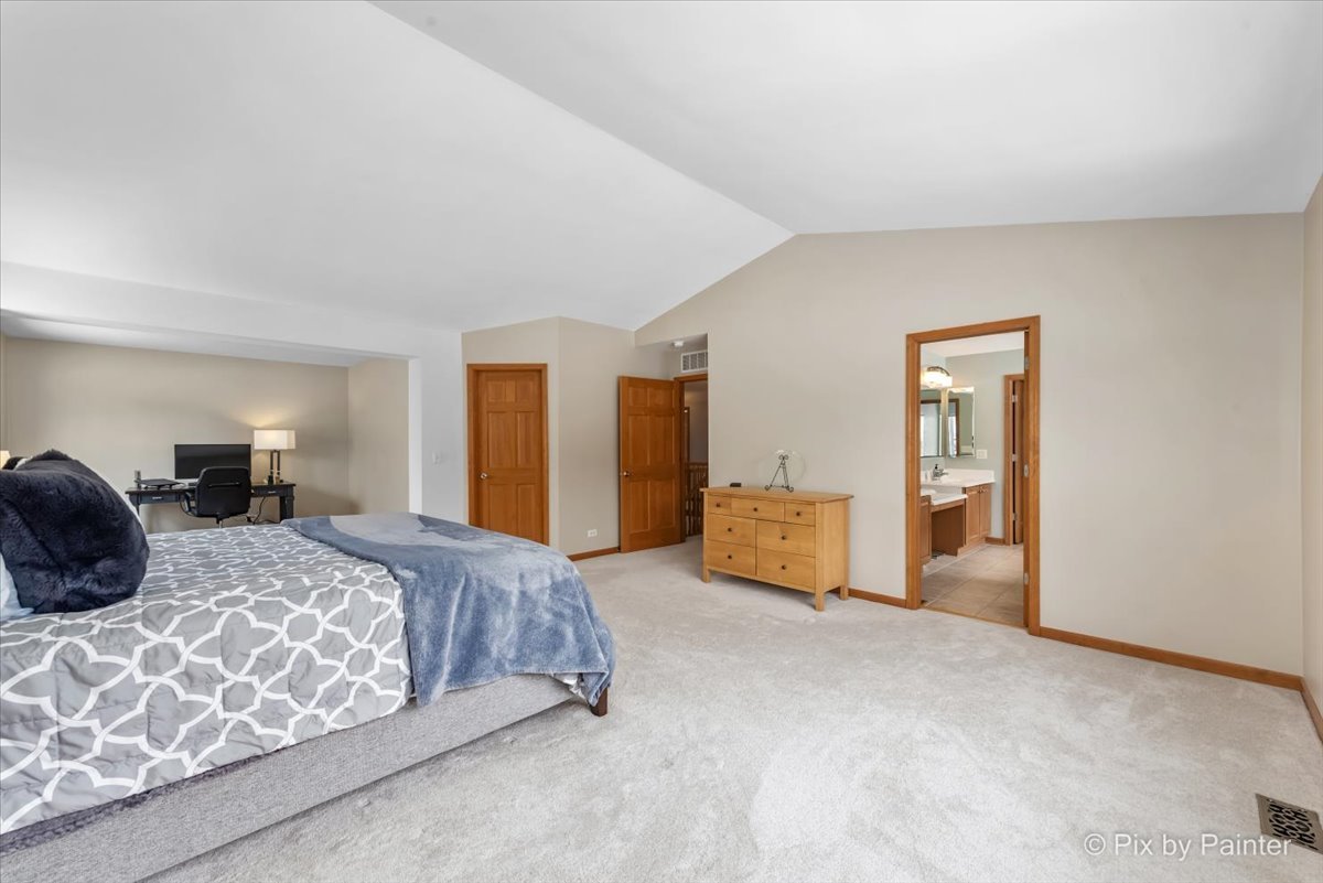 488 Newcastle Drive Cary, IL 60013 - Photo 22 of 33 a bedroom with a large bed and a couch