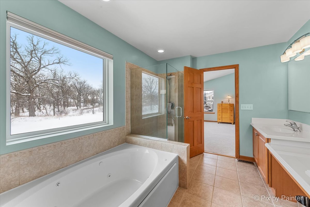 488 Newcastle Drive Cary, IL 60013 - Photo 24 of 33 a bathroom with a bathtub and a sink