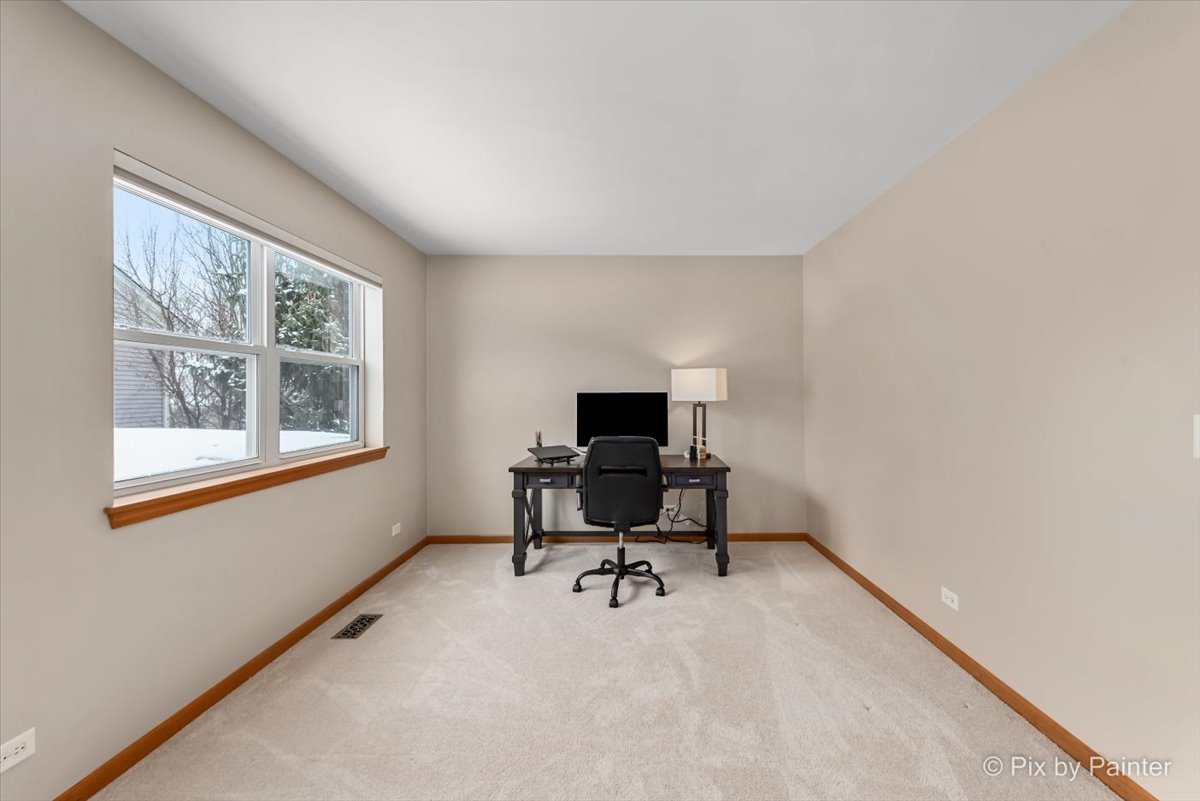 488 Newcastle Drive Cary, IL 60013 - Photo 25 of 33 a workspace with furniture and a window