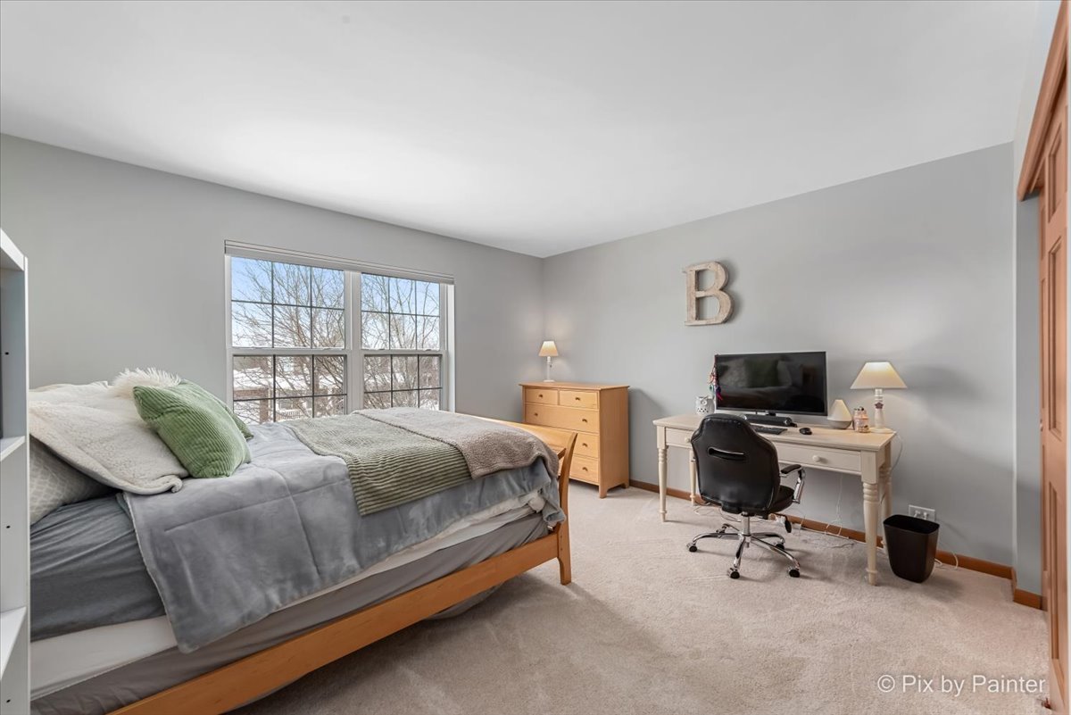 488 Newcastle Drive Cary, IL 60013 - Photo 27 of 33 a bedroom with a bed and a desk