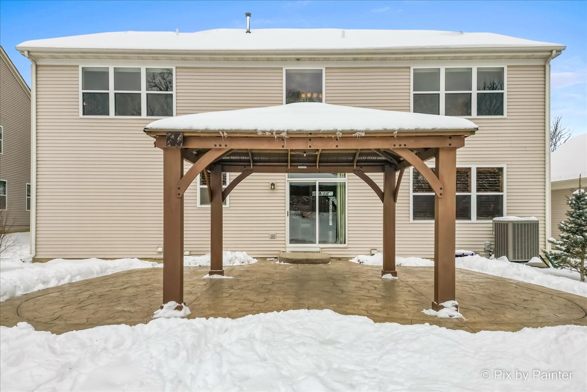 488 Newcastle Drive Cary, IL 60013 - Photo 32 of 33 a front view of a house with a yard