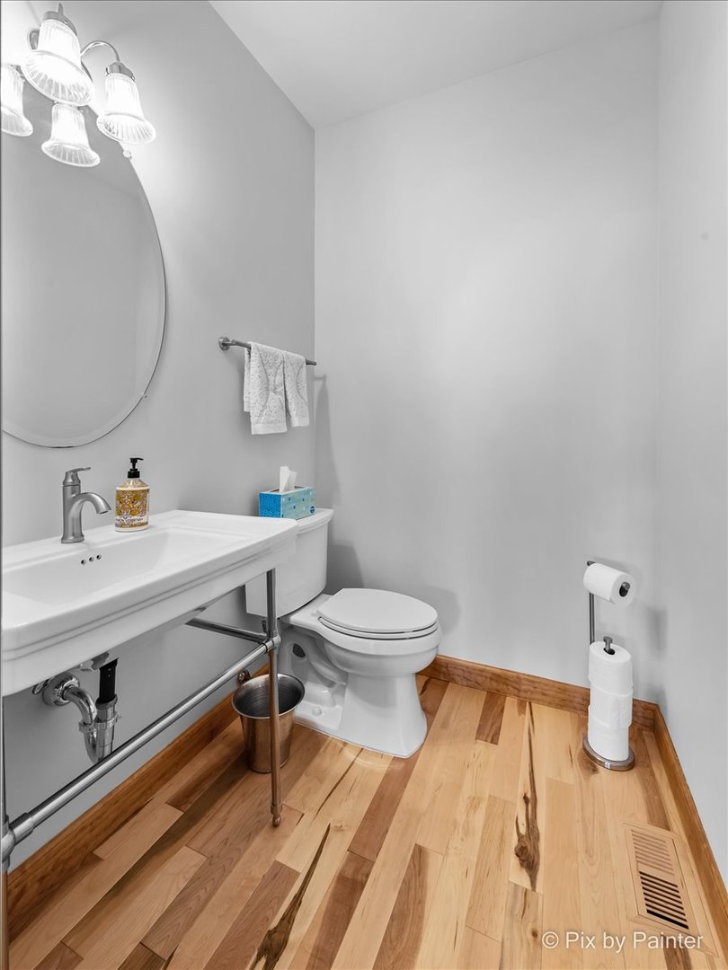 488 Newcastle Drive Cary, IL 60013 - Photo 9 of 33 a bathroom with a sink mirror vanity and toilet