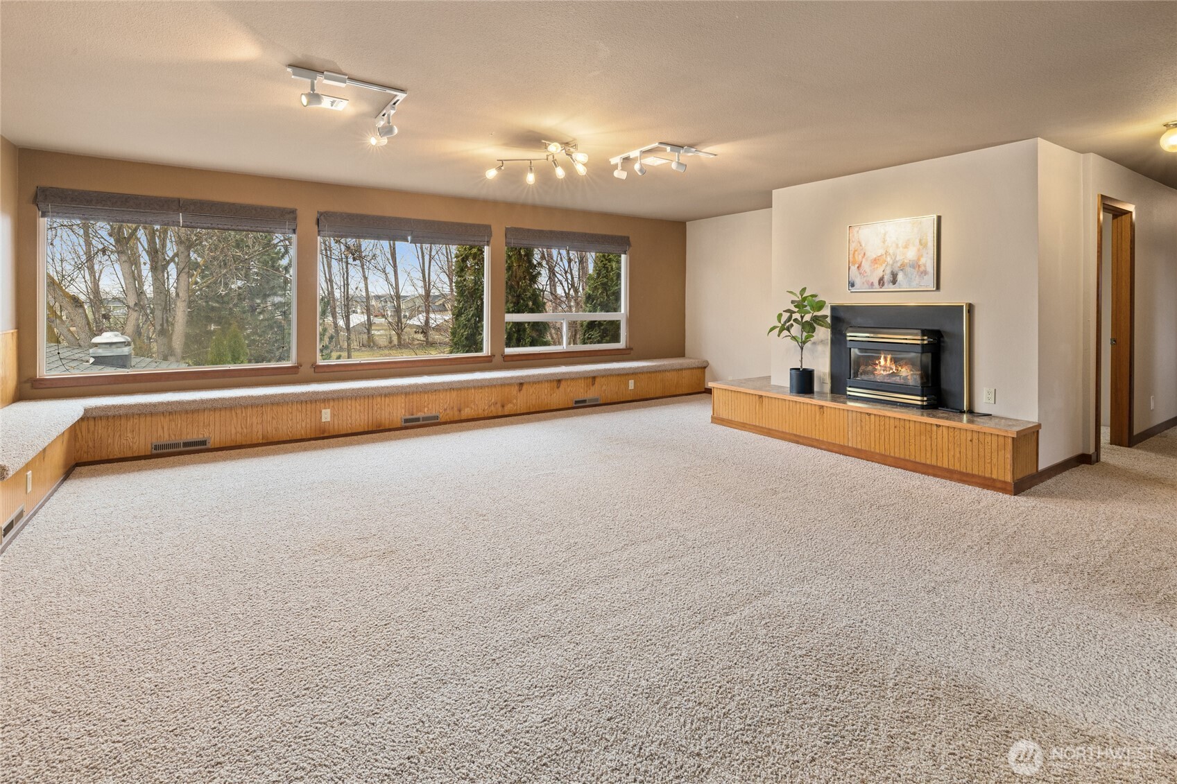 709 South Matthews Road Ellensburg, WA 98926 - Photo 21 of 40 a view of an empty room with a fireplace and a window