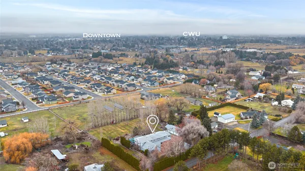 an aerial view of a house with a ocean view