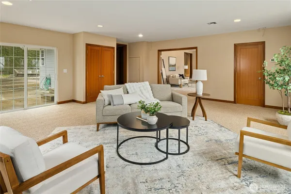 a large kitchen with a table and chairs