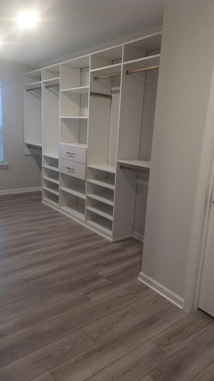 4830 Spangle Court Cumming, GA 30028 - Photo 18 of 18 a view of walk in closet with empty racks