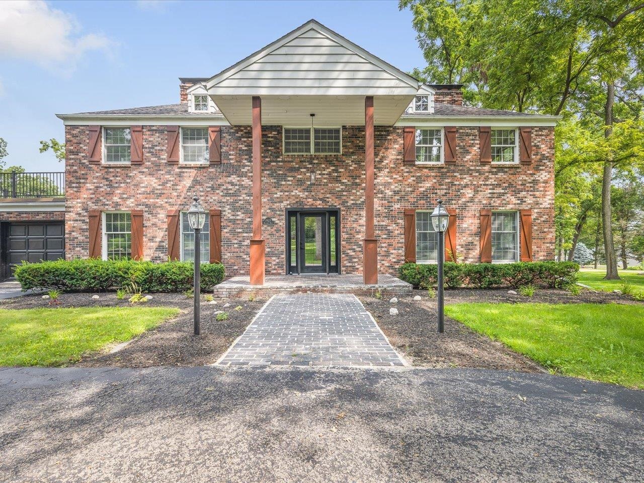 1927 Baintree Road Lake Summerset, IL 61019 - Photo 2 of 71 a front view of a house with a yard and garage