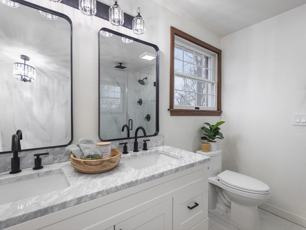 1927 Baintree Road Lake Summerset, IL 61019 - Photo 37 of 71 a bathroom with a granite countertop sink toilet and mirror