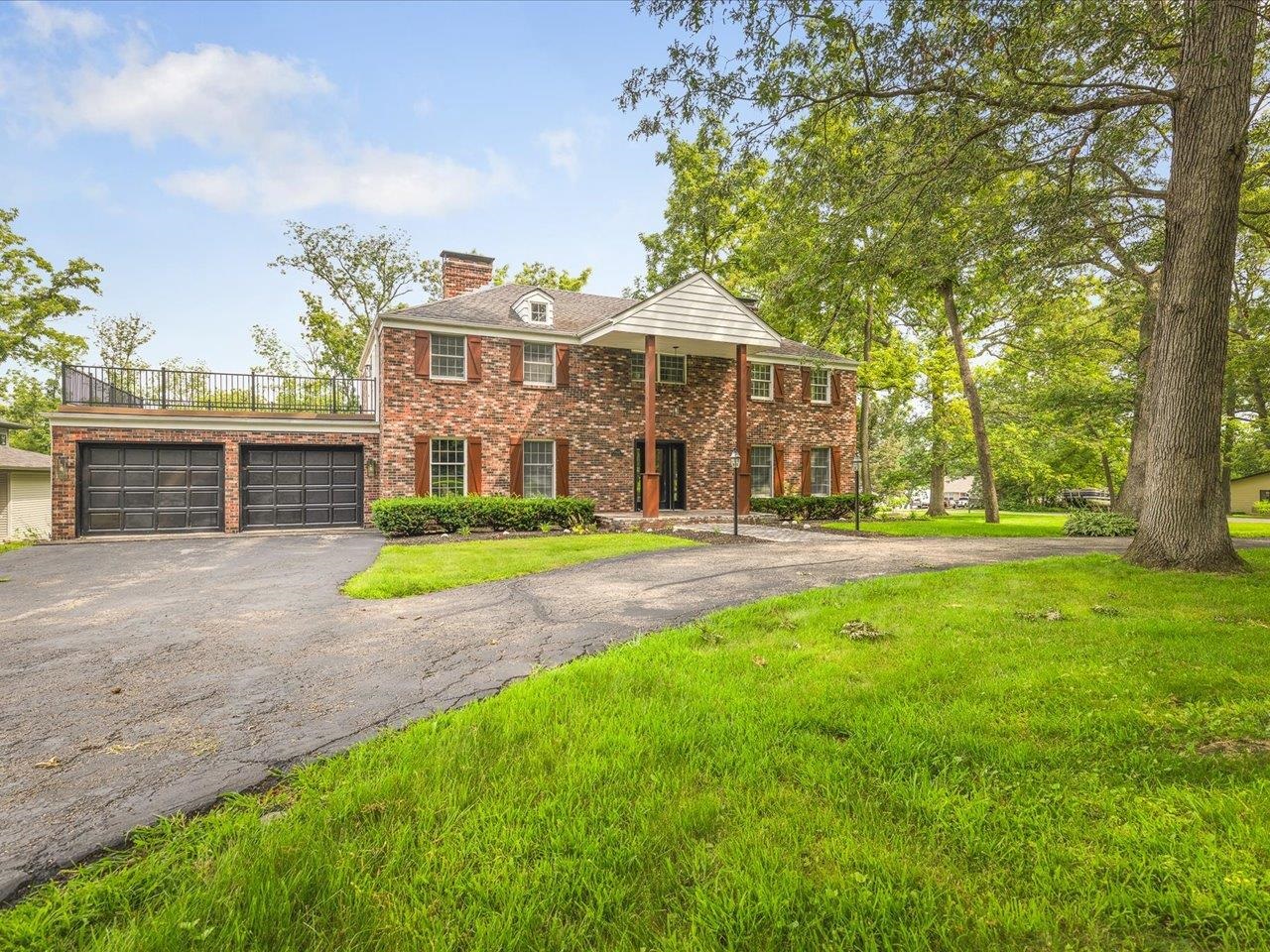 1927 Baintree Road Lake Summerset, IL 61019 - Photo 60 of 71 a front view of a house with garden