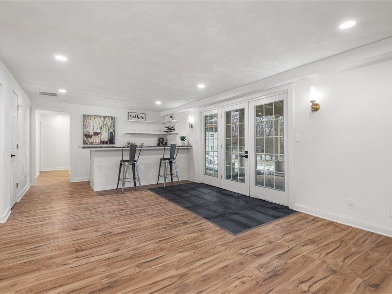 1927 Baintree Road Lake Summerset, IL 61019 - Photo 67 of 71 a view of a big room with wooden floor and windows