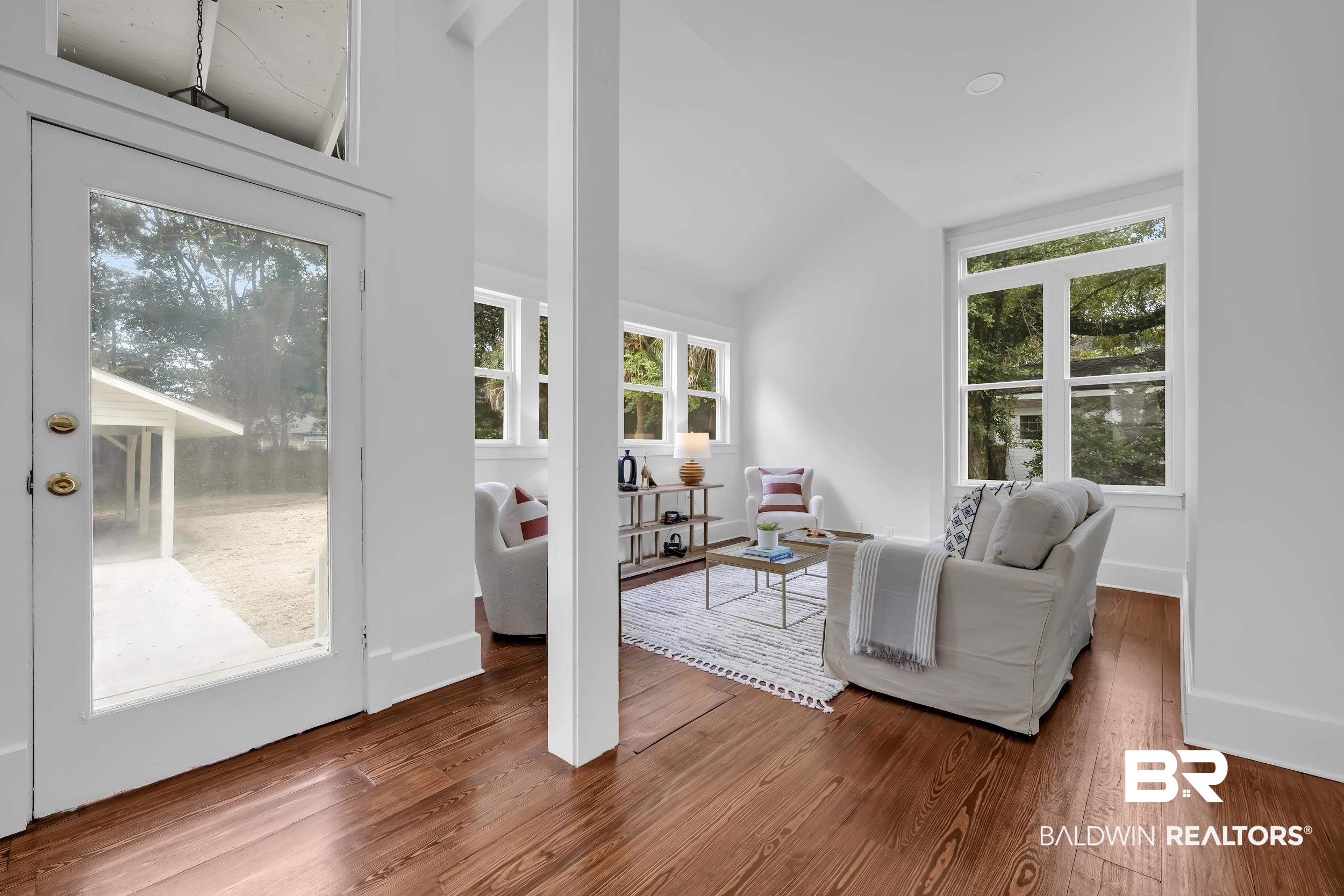 1662 Government Street Mobile, AL 36604 - Photo 18 of 33 Living room with wood finished floors, plenty of natural light, and vaulted ceiling