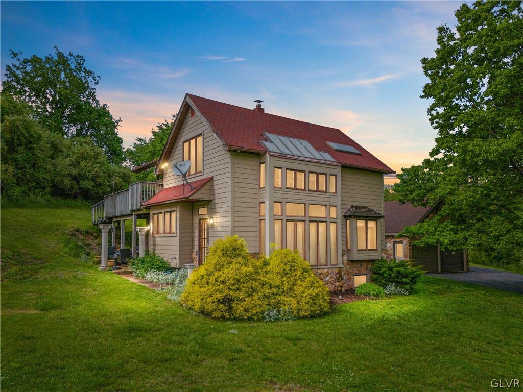 9325 Danner Road New Tripoli, PA 18066 - Photo 1 of 50 a front view of a house with a garden