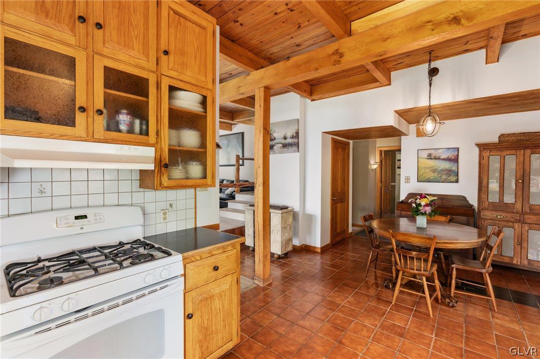 9325 Danner Road New Tripoli, PA 18066 - Photo 11 of 50 a kitchen with a stove and a table chair