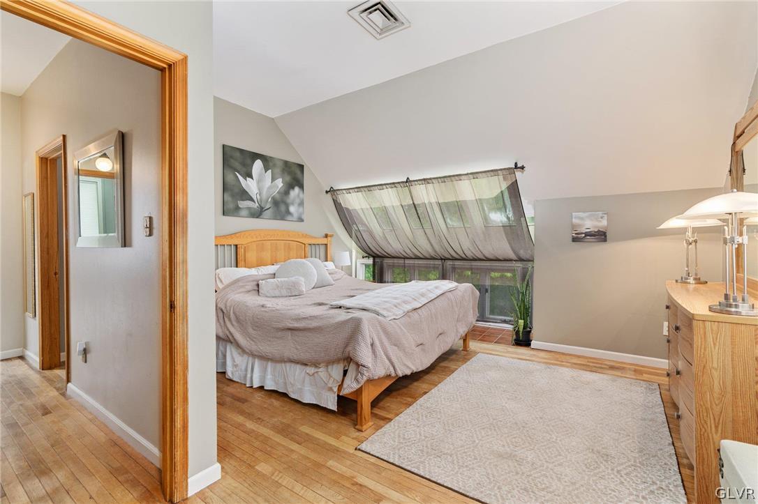 9325 Danner Road New Tripoli, PA 18066 - Photo 30 of 50 a bedroom with a bed and wooden floor