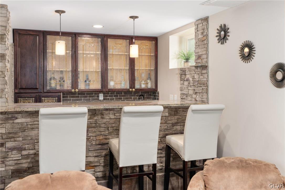 9325 Danner Road New Tripoli, PA 18066 - Photo 39 of 50 a kitchen with a table chairs sink and cabinets