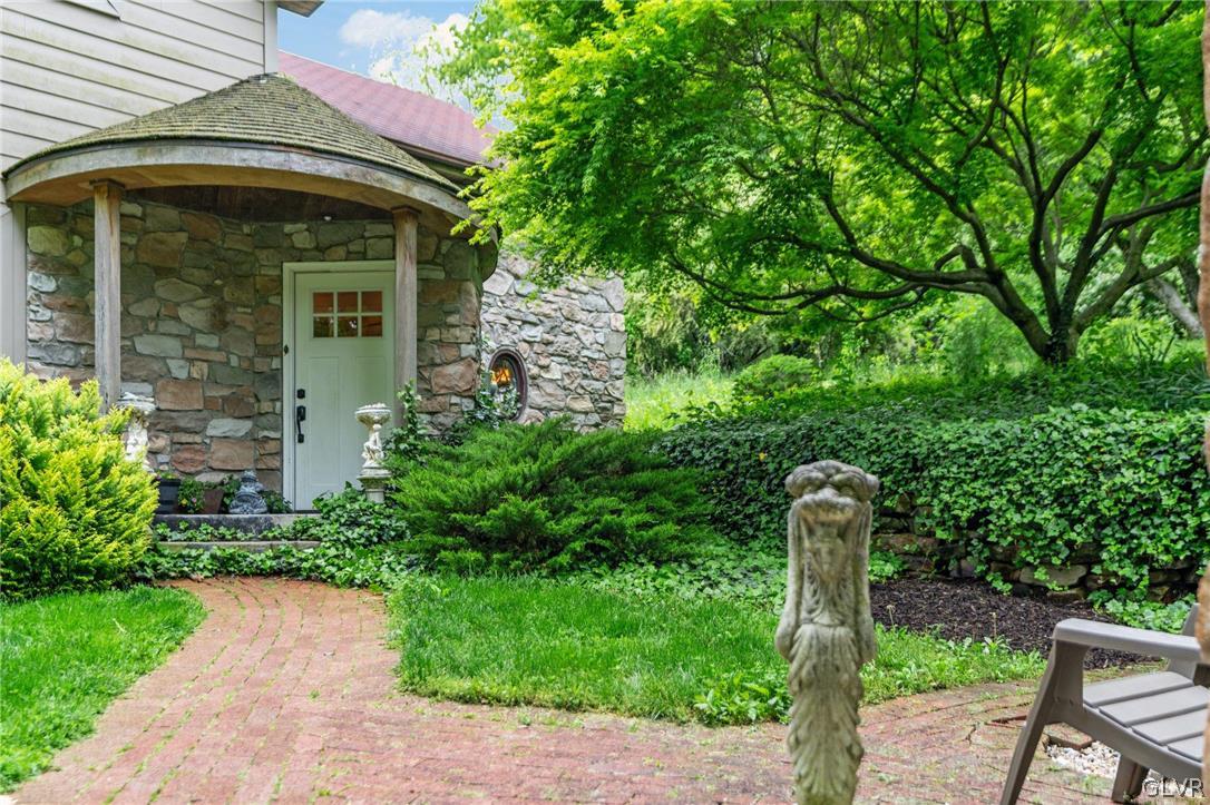 9325 Danner Road New Tripoli, PA 18066 - Photo 4 of 50 a front view of a house with garden