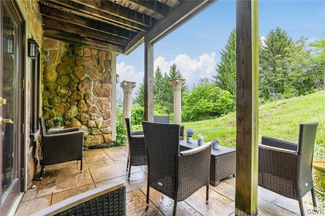 9325 Danner Road New Tripoli, PA 18066 - Photo 41 of 50 a view of a patio with table and chairs potted plants with wooden floor