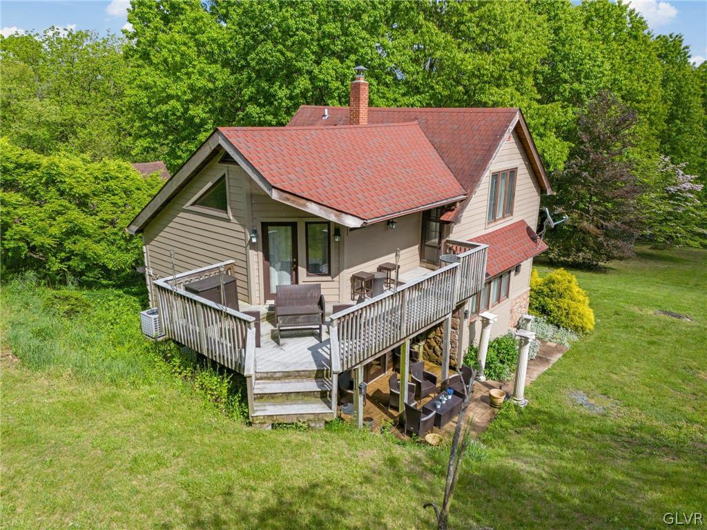 9325 Danner Road New Tripoli, PA 18066 - Photo 44 of 50 a view of a house with a yard and deck