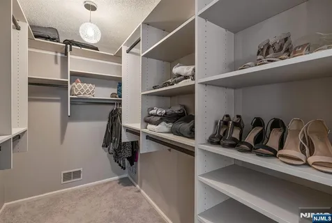 a view of a closet with storage