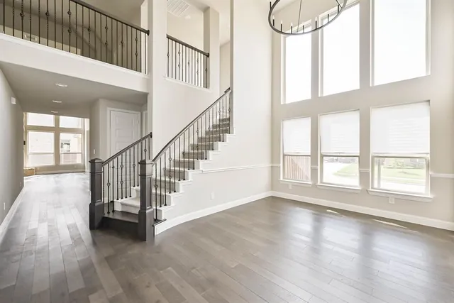 a view of an entryway with wooden floor