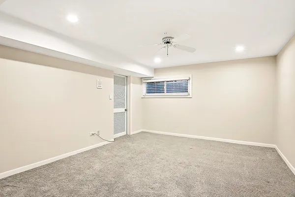 an empty room with a empty space and windows