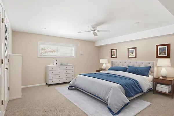a bedroom with a bed and a dresser