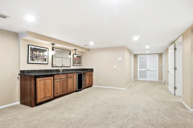 a living room with furniture a fireplace and a table