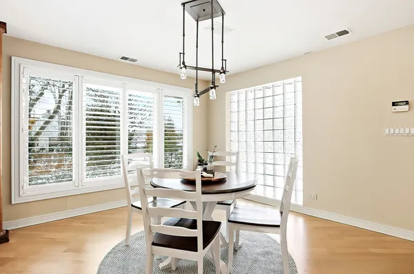 a dining room with furniture and windows