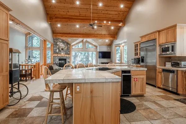 a dining room with furniture and wooden floor
