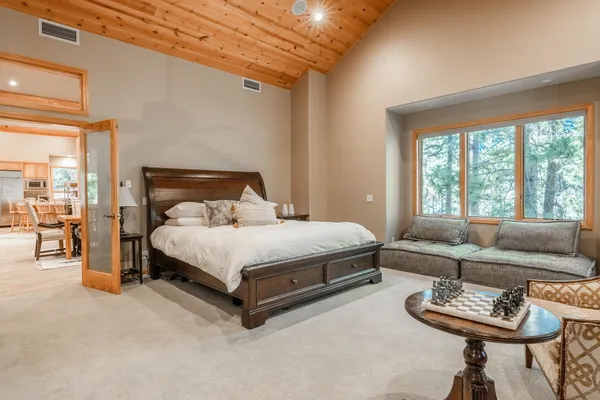 a kitchen with stainless steel appliances kitchen island granite countertop a stove and a sink