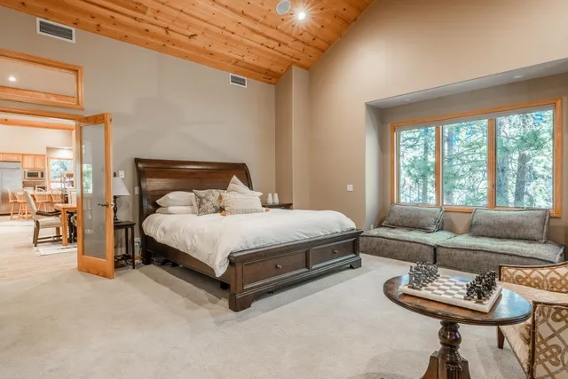 a kitchen with stainless steel appliances kitchen island granite countertop a stove and a sink