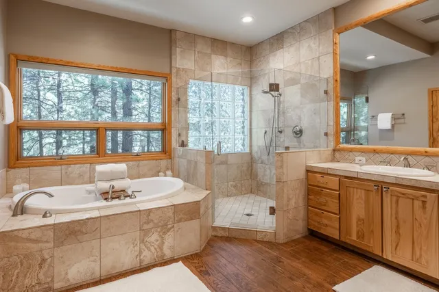 a spacious bedroom with a bed and a table in it