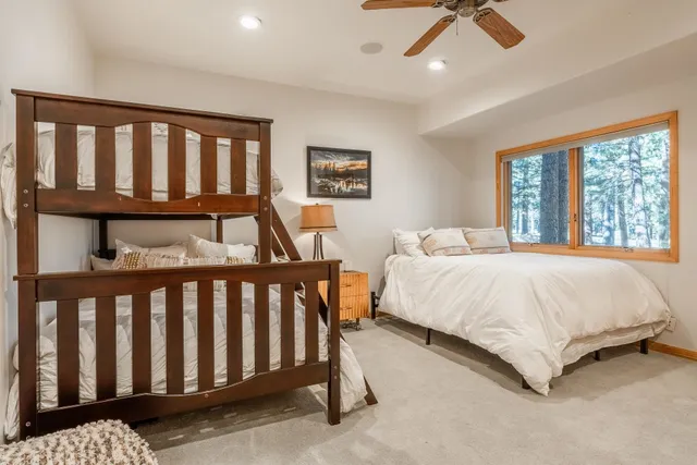 a bedroom with a bed and a desk