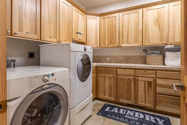a bathroom with double vanity sinks and a mirror