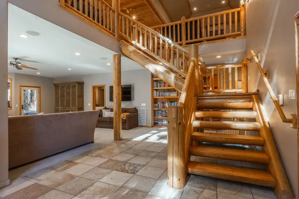 a view of entryway livingroom and hall with wooden floor