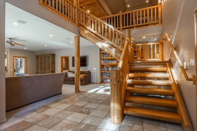 a view of entryway livingroom and hall with wooden floor